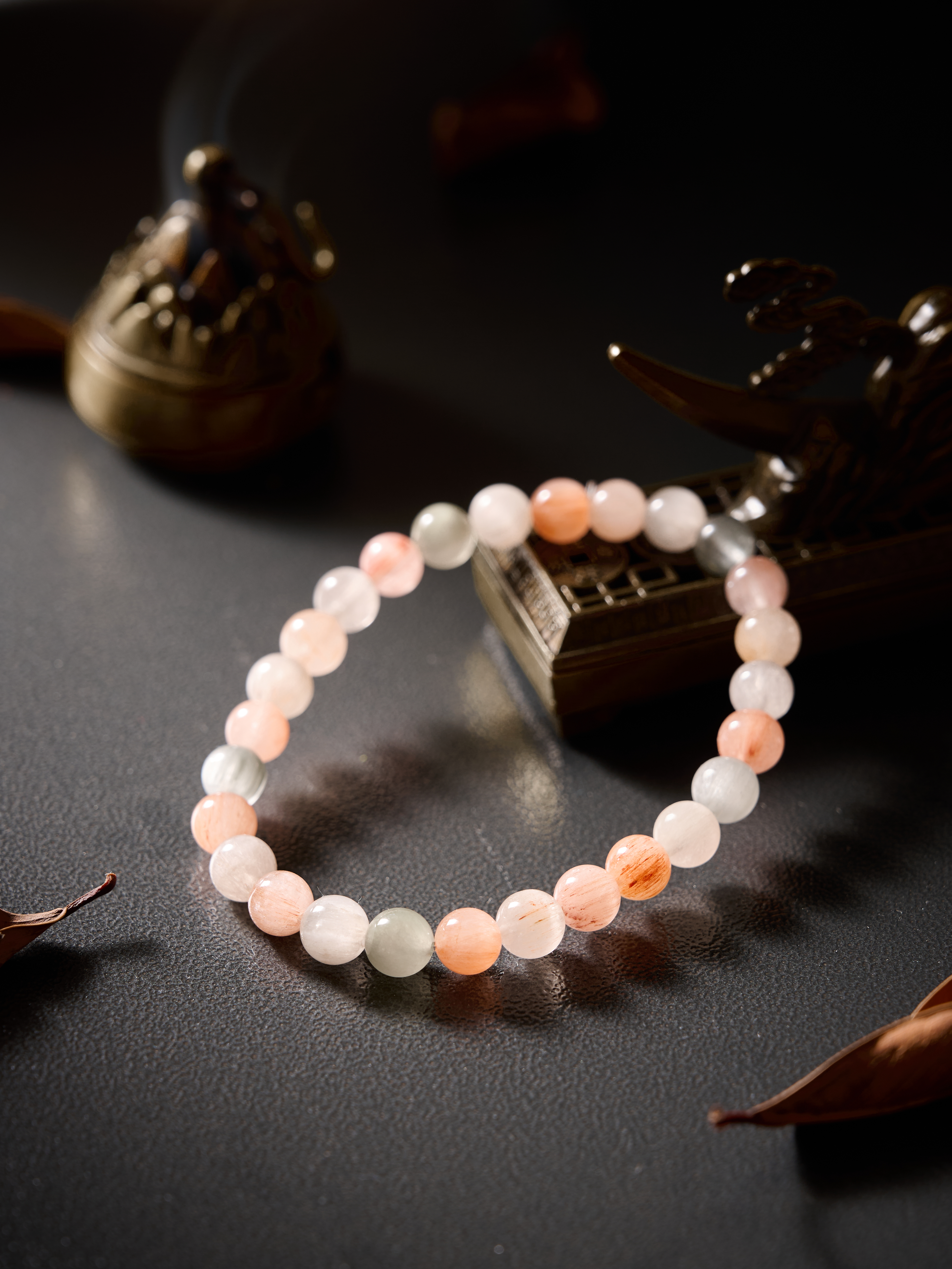 Main product on dark background – Natural Rutilated Quartz bracelet, polished round beads, minimalist style.