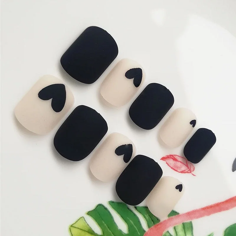 24Pcs Fake Nail Tips For Women Frosted Matte Nails with glue Nude with Black Love Heart Print designs Press On false fingernail-Nail Inspo