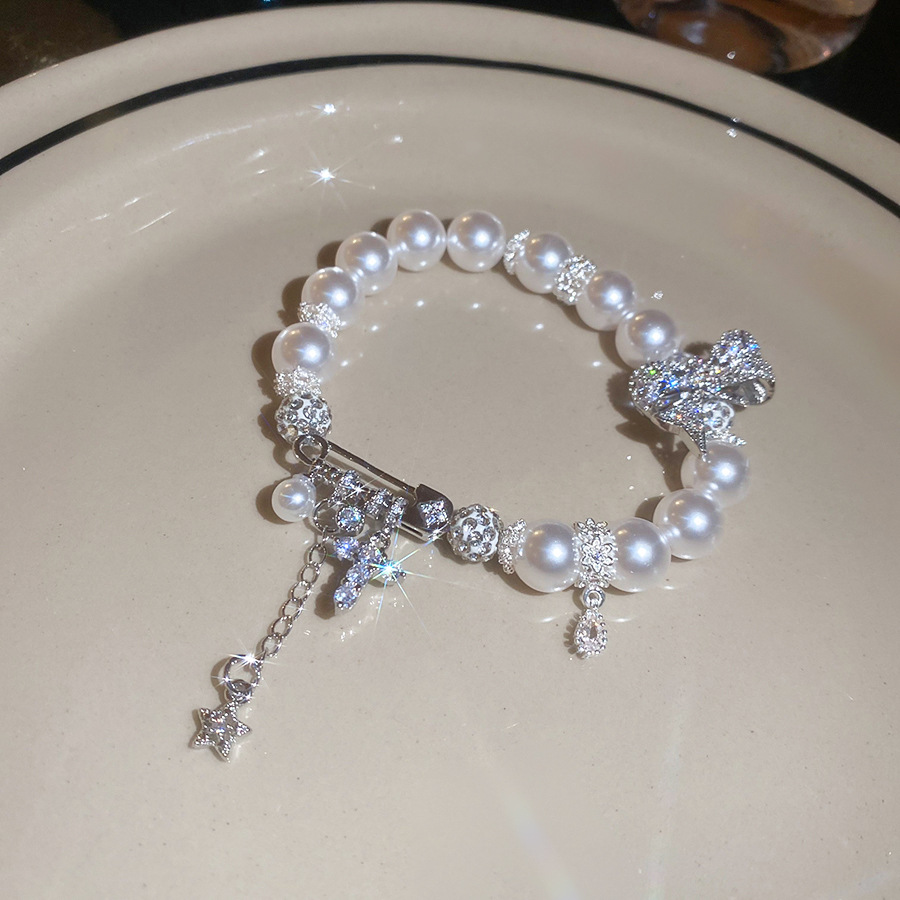 Zircon bow cross pearl bracelet a luxurious and sophisticated bracelet a unique and elegant accessory for women