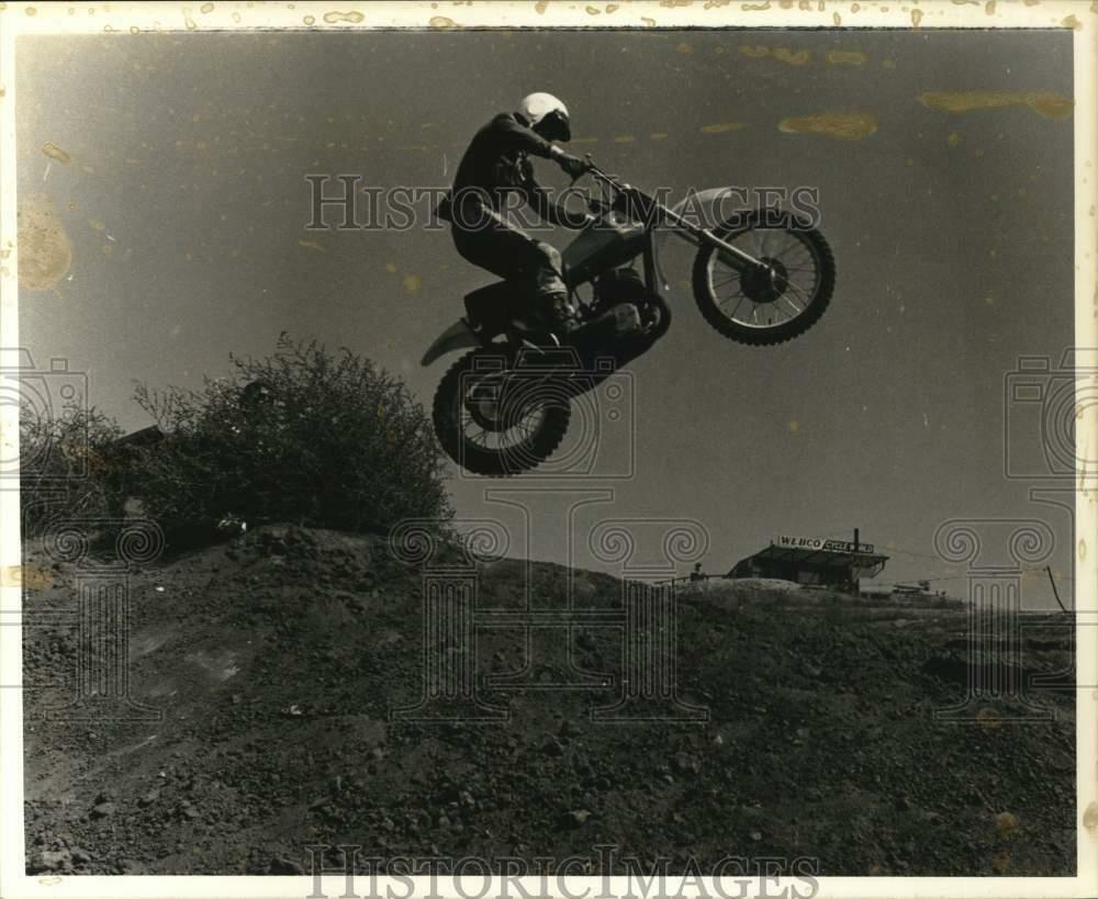 Press Photo Poster painting Motorcycle Jump in Dixie Dynamite