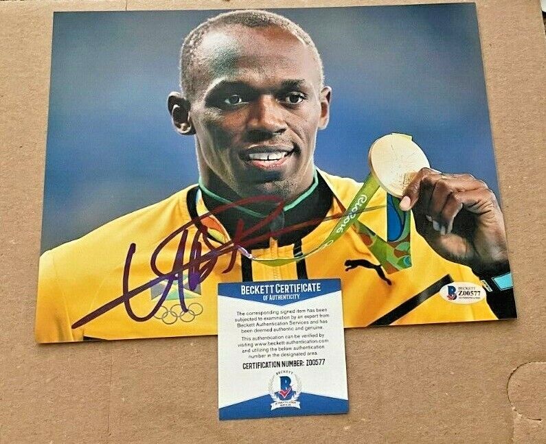 USAIN BOLT SIGNED 2016 RIO OLYMPICS 8X10 Photo Poster painting BECKETT CERTIFIED #5