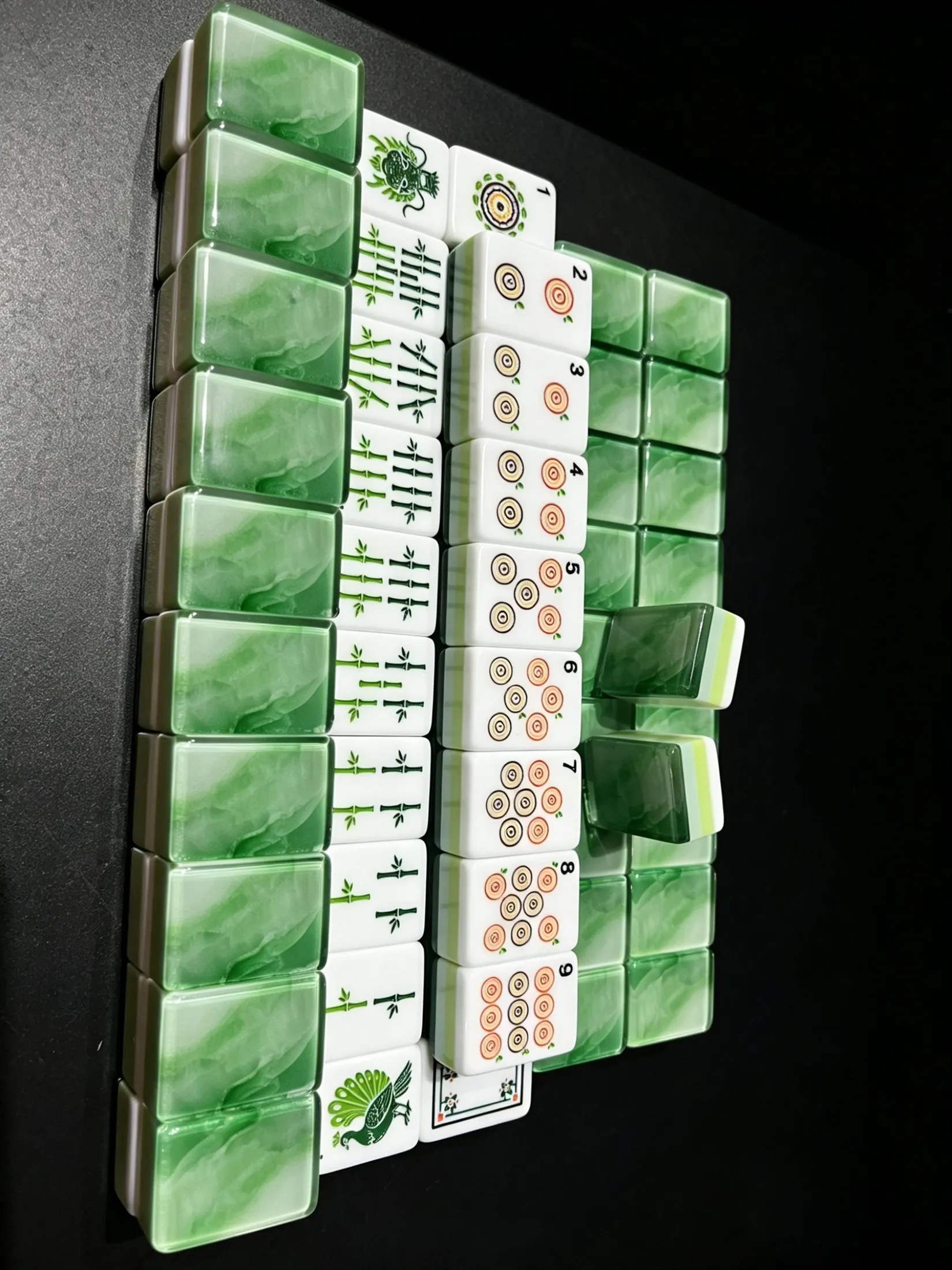 Jade Wave tiles arranged to show the complete back and face design.