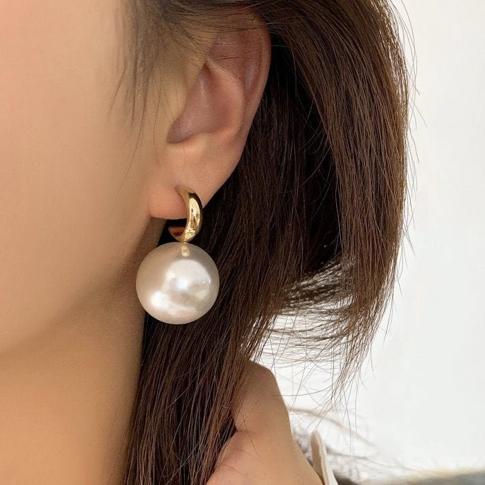 Round large pearl earrings