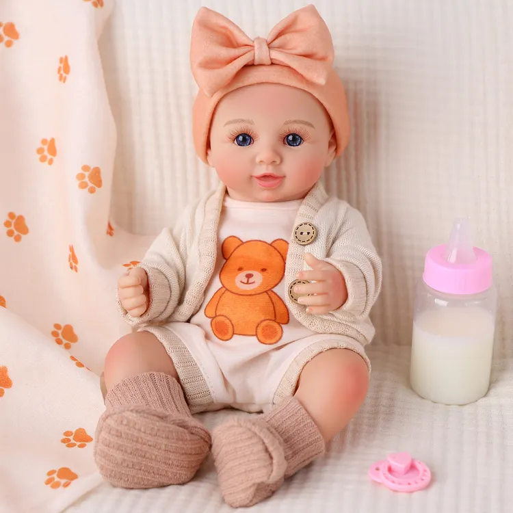 Babeside Cody 12&ldquo; Unisex Vinyl Reborn Baby Doll with Smiling Infant Face in Orange Bow Hat and Bear Outfit