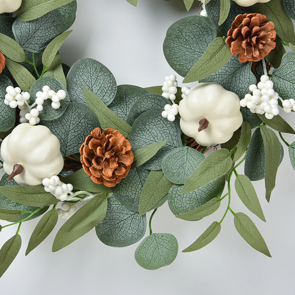 White pumpkin wreath decoration with eucalyptus leaves