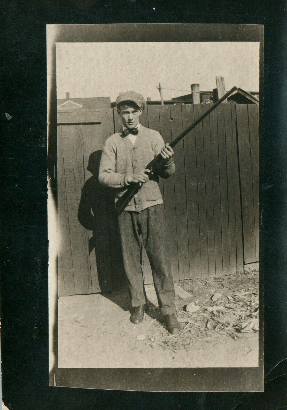 Antique Vintage Young Man with Bow Tie Holding Rifle RPPC Real Photo Poster painting Postcard