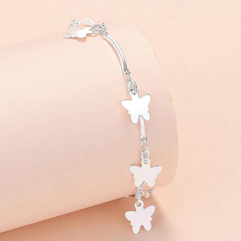 Sterling Silver Butterfly and Cross Charm Bracelet Collection