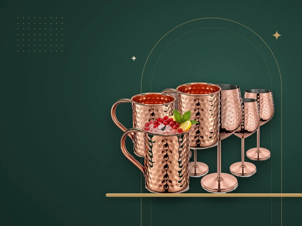 Hammered copper-tone mugs and goblets on a gold shelf