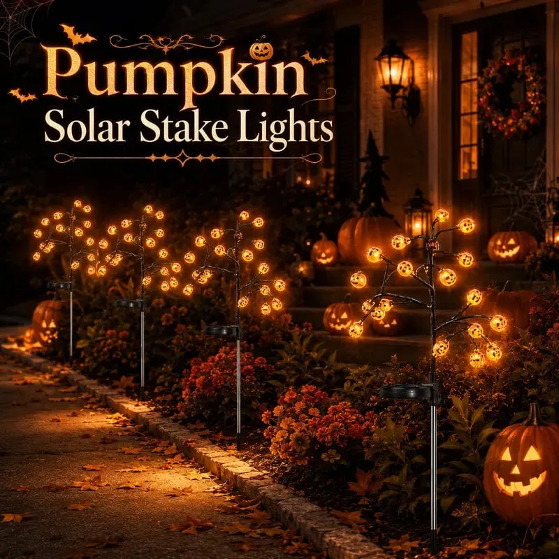 4PCS solar pumpkin stake lights in a Halloween yard