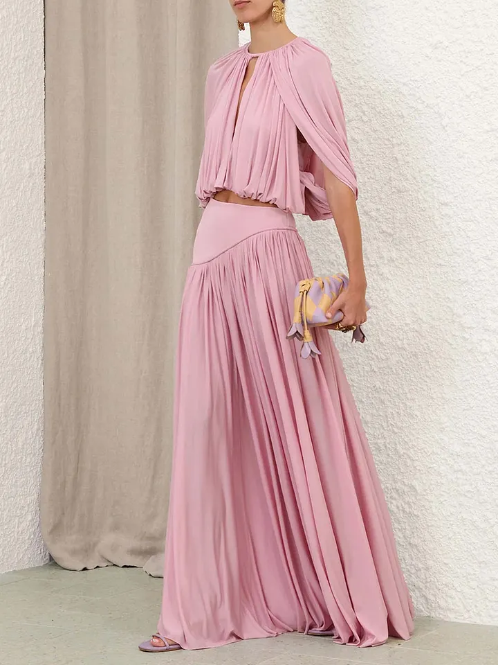 Woman wearing a dusty rose two-piece set as a wedding guest