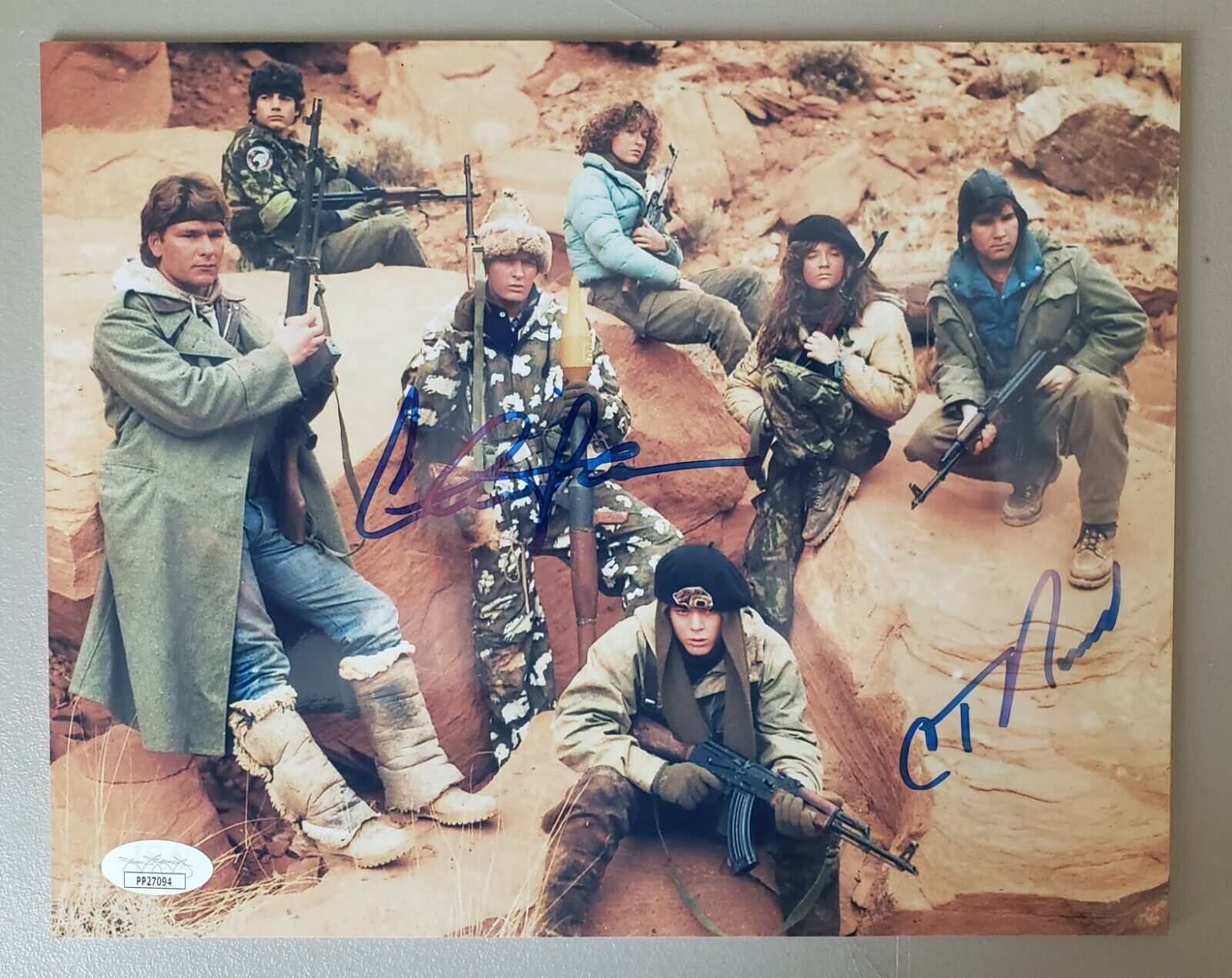 8X10 Autographed by Charlie Sheen and C Thomas Howell in Red Dawn. JSA