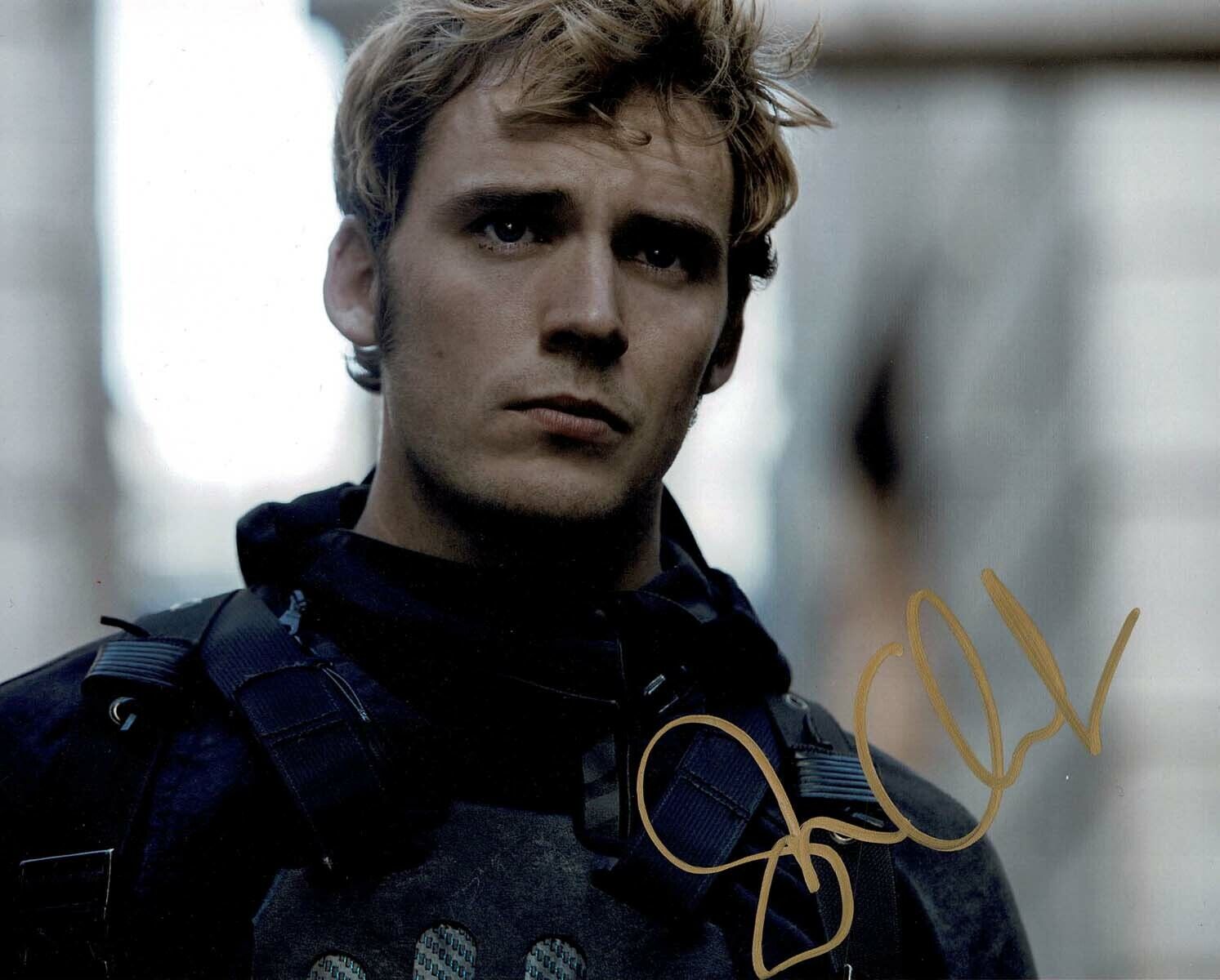 Sam CLAFLIN SIGNED 10x8 Photo Poster painting Autograph AFTAL COA The Hunger Games MOCKINGJAY