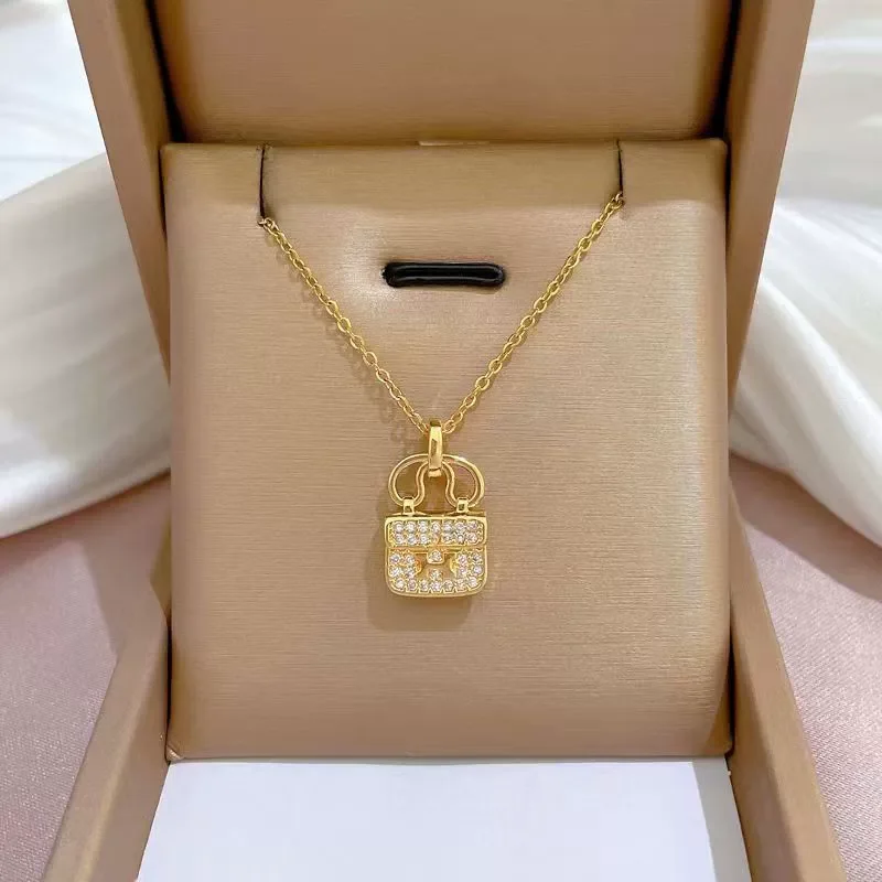 Handbag shaped zirconia gold plated necklace