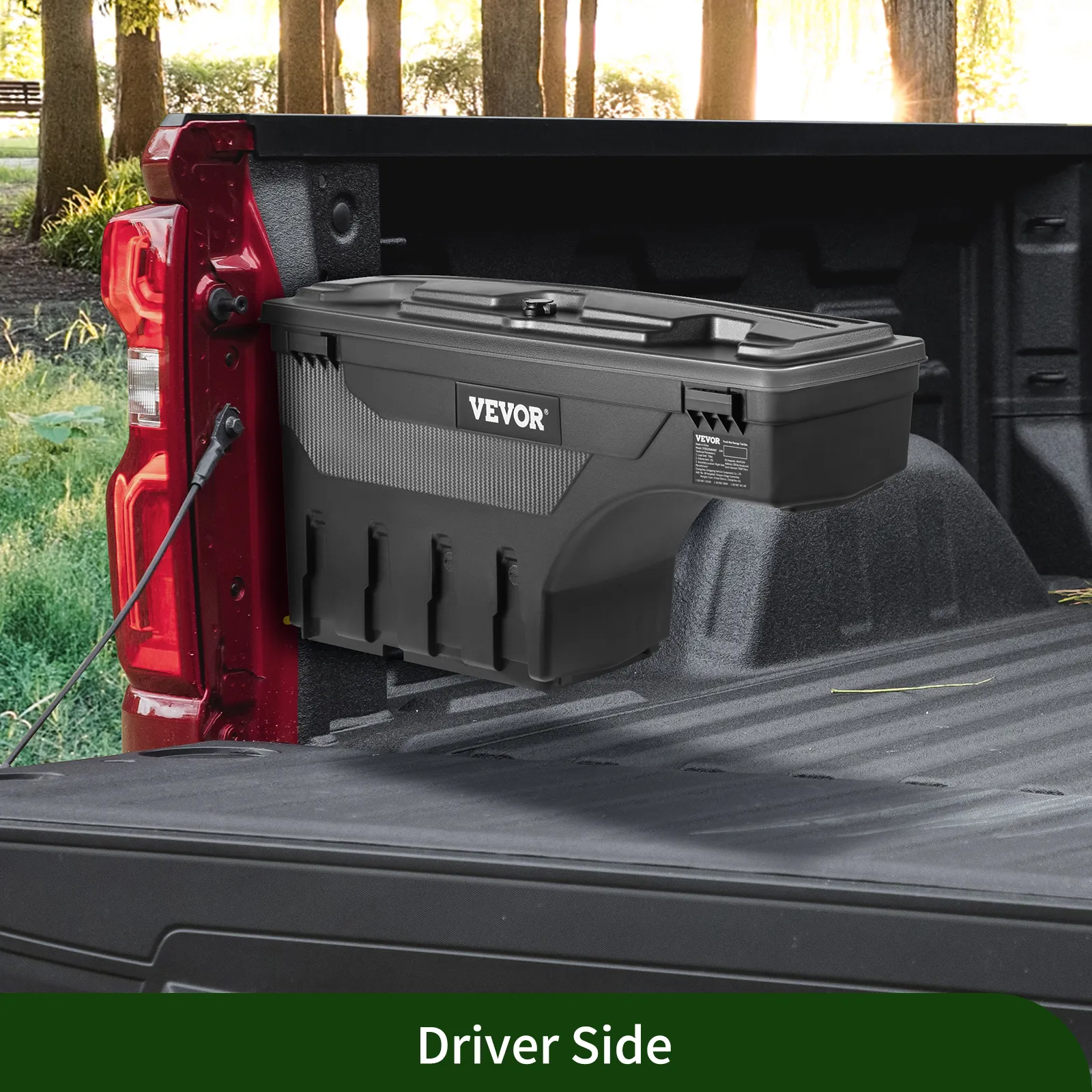VEVOR truck bed storage box installed on a red truck bed, driver's side, in a wooded area.
