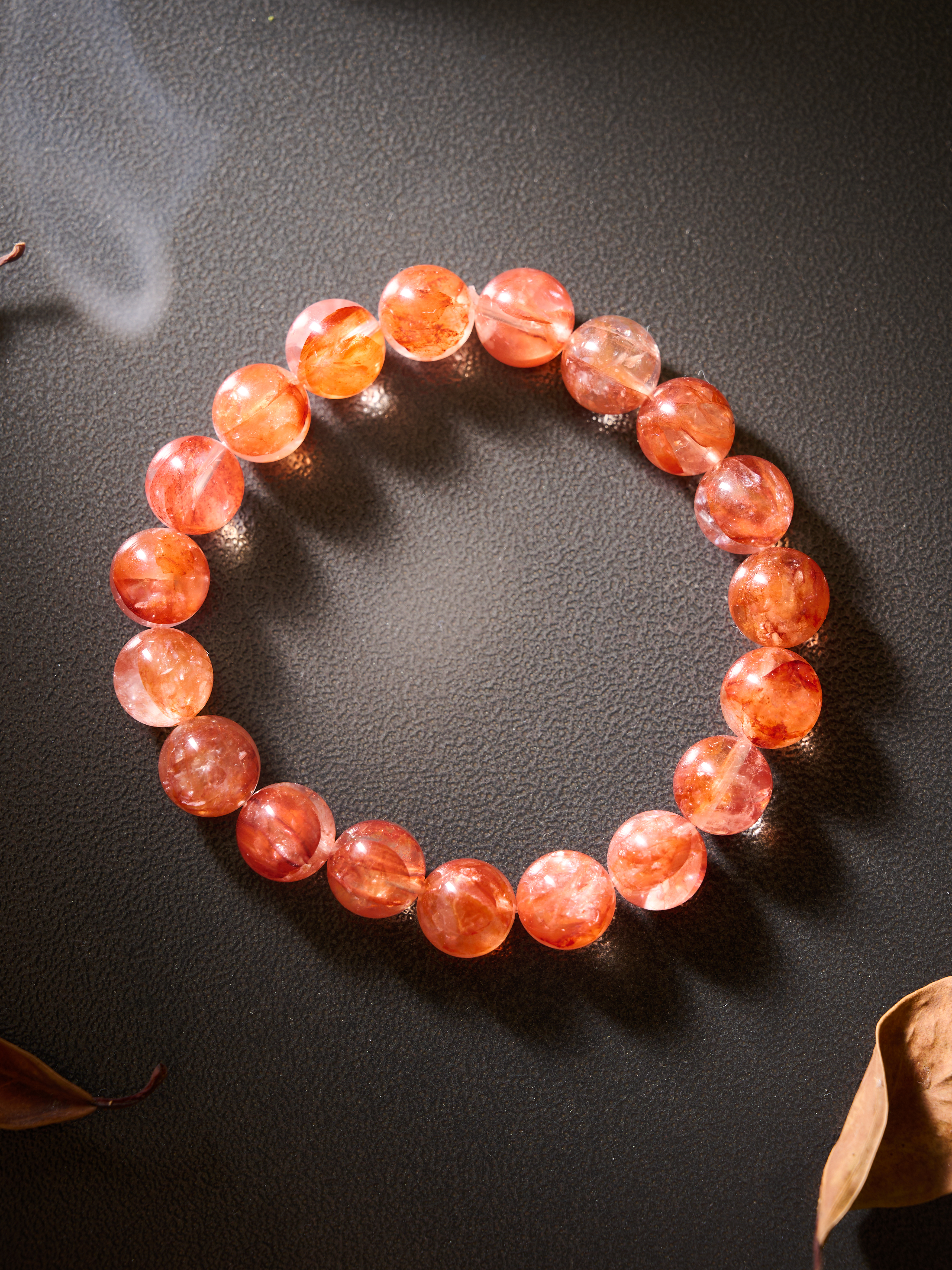AvigJewelry red garden quartz (lepidocrocite-in-quartz) handcrafted bracelet, elastic 16–18 cm — full flat-lay top view