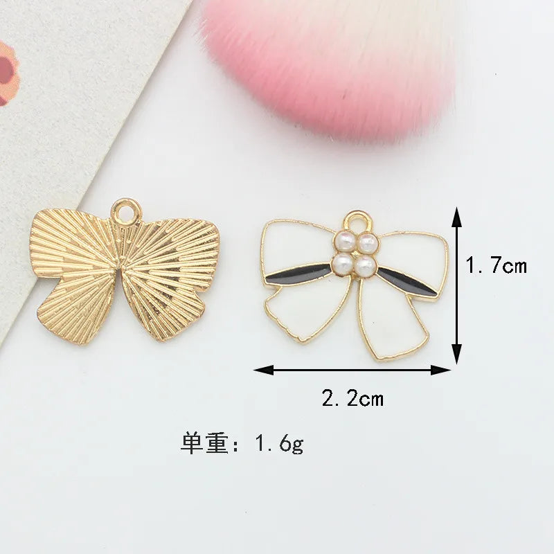 10 PCS/Package 1.5 * 20mm 14 * 14mm 7 * 12mm Alloy Rhinestones Pearl Number Heart Shape Bow Knot Polished Pendant