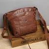 Sac &agrave; bandouli&egrave;re en cuir souple &agrave; pochettes multiples