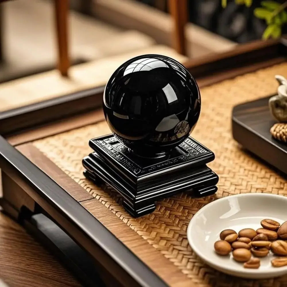 Black Obsidian sphere styled on a desk