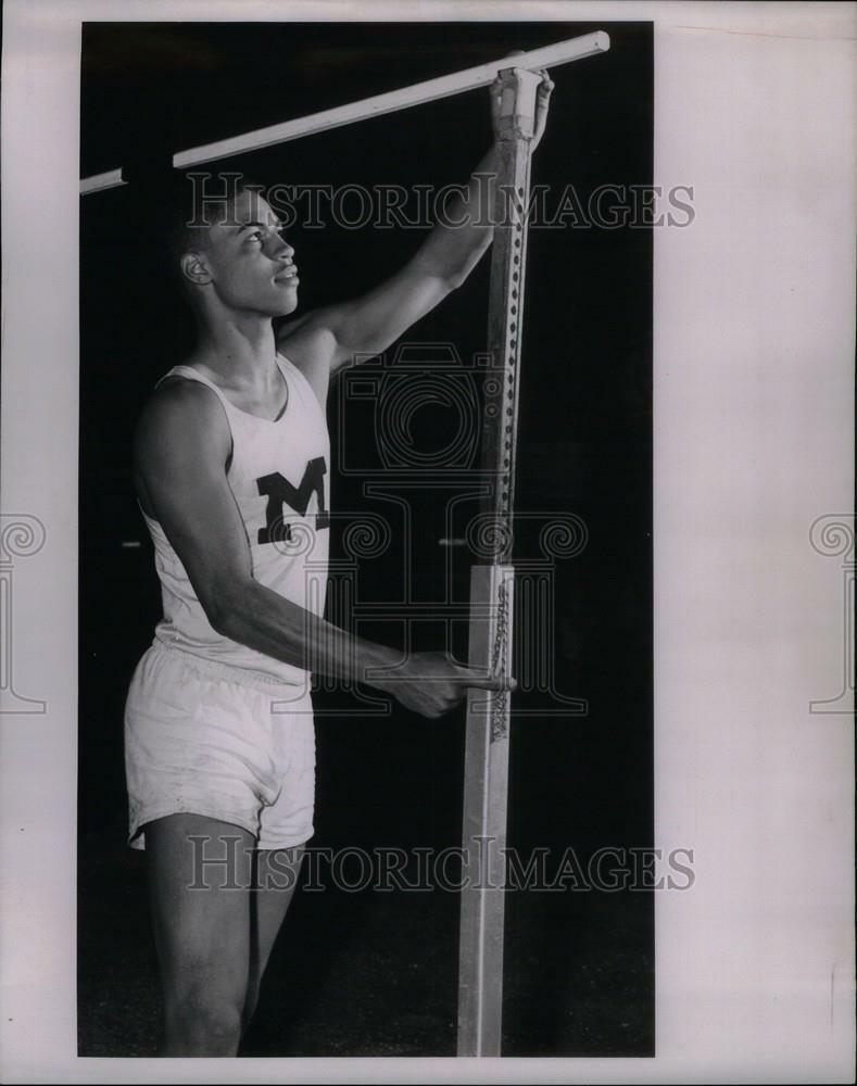 Press Photo Poster painting Lowell Perry Michigan High Jump - DFPC84161