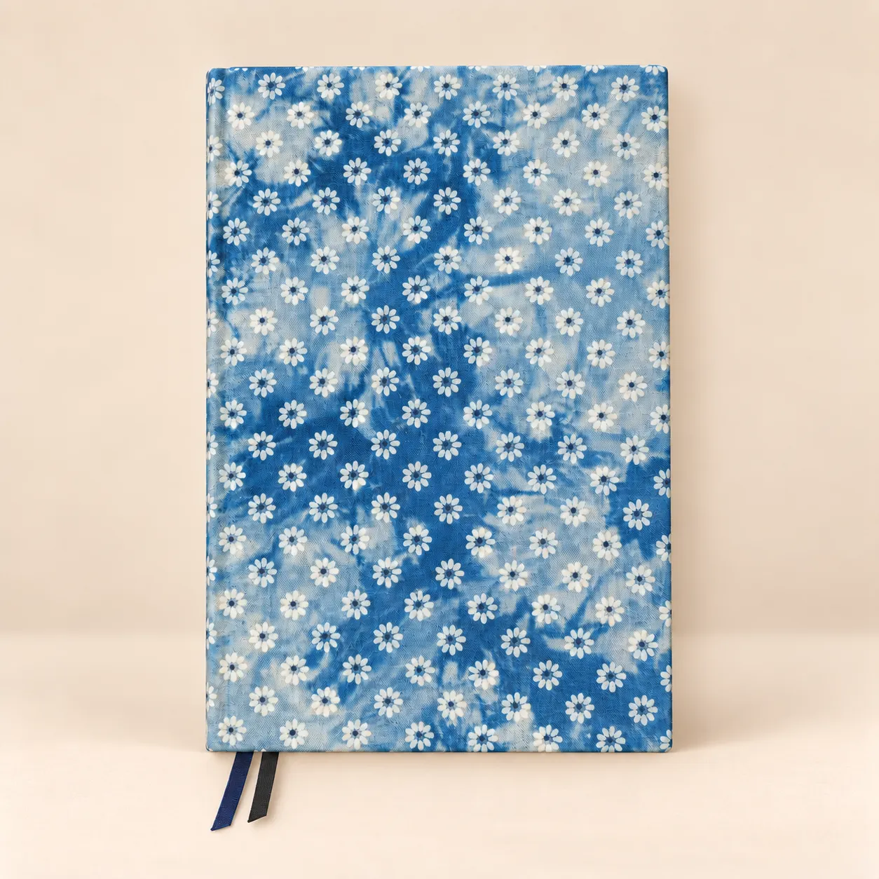 Front view of a blue floral notebook