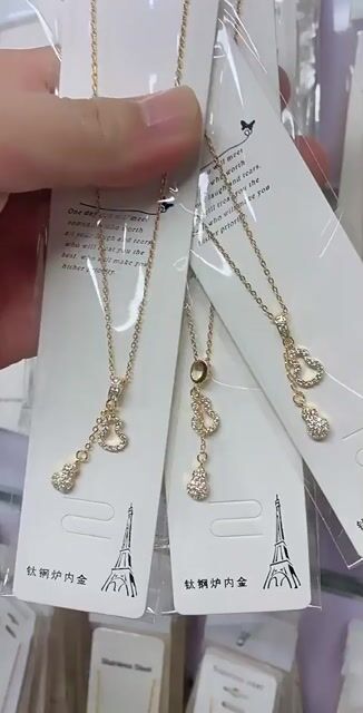 Double-layered, gold-plated brass, zircon, gourd, titanium, steel necklace.