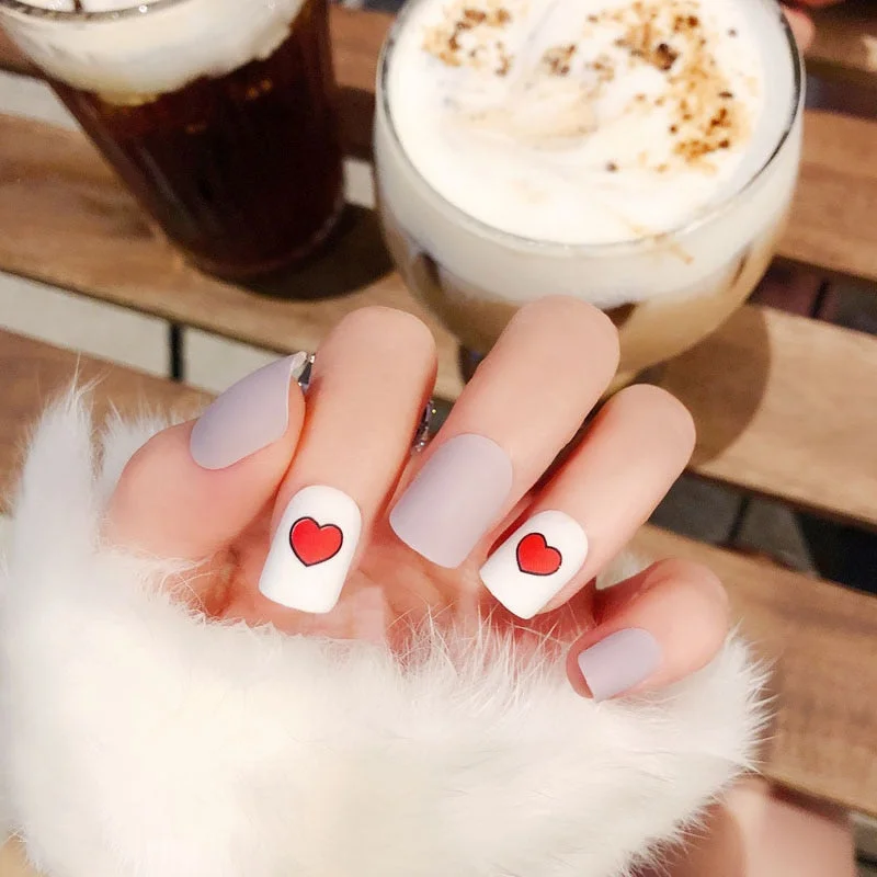 24Pcs Fake Nail Tips For Women Frosted Matte Nails with glue Nude with Black Love Heart Print designs Press On false fingernail-Nail Inspo