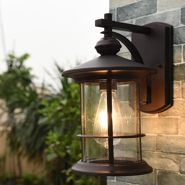 Clear Seeded Glass Cylinder Sconce Light Lodges 1-Bulb Outdoor Wall Mounted Lamp in Black/Coffee for Garden