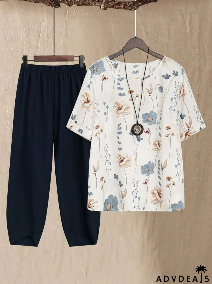 Plus Size Women Loose Fit Floral Print Round Neck Short Sleeve Top And Tapered Pants Summer Two Piece Set