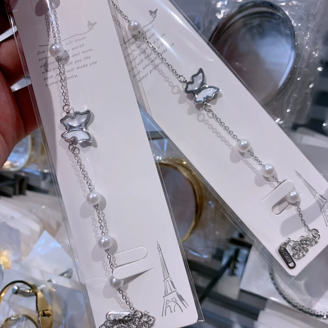 Butterfly and pearl bracelet