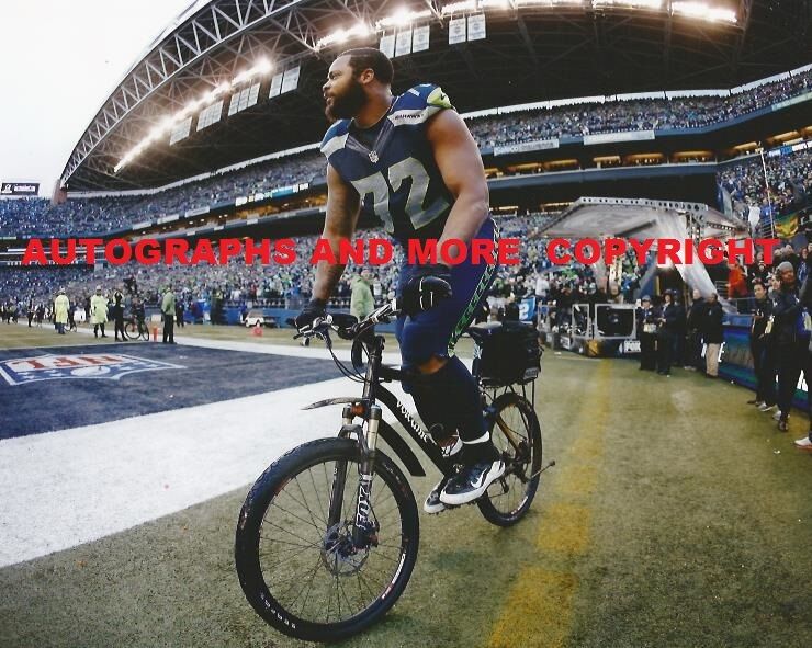 MICHAEL BENNETT SEATTLE SEAHAWKS 8x10 Photo Poster painting - RIDES POLICE BIKE AFTER GAME