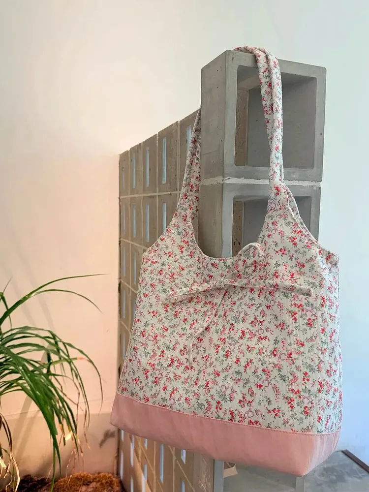 Pink base and floral pattern canvas tote bag