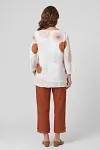 Back view of artistic print linen two-piece set showing relaxed fit and layered hem detail