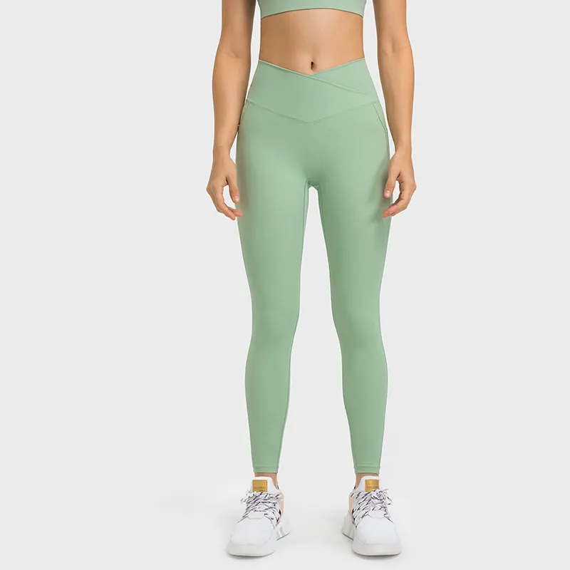 Shop no front seam high waist criss cross capri leggings with side pockets online on Hergymclothing Light Mint
