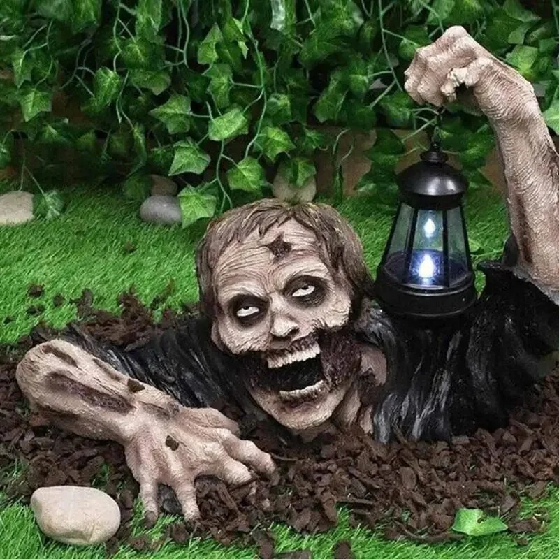 Scary Zombies Crawling Out of The Ground with Lantern