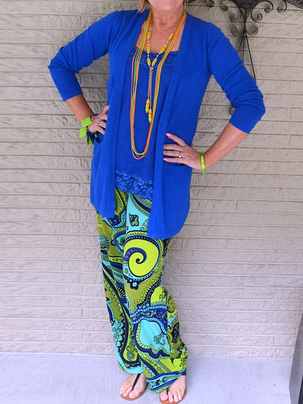 Three-piece suit of solid color blouse and printed trousers