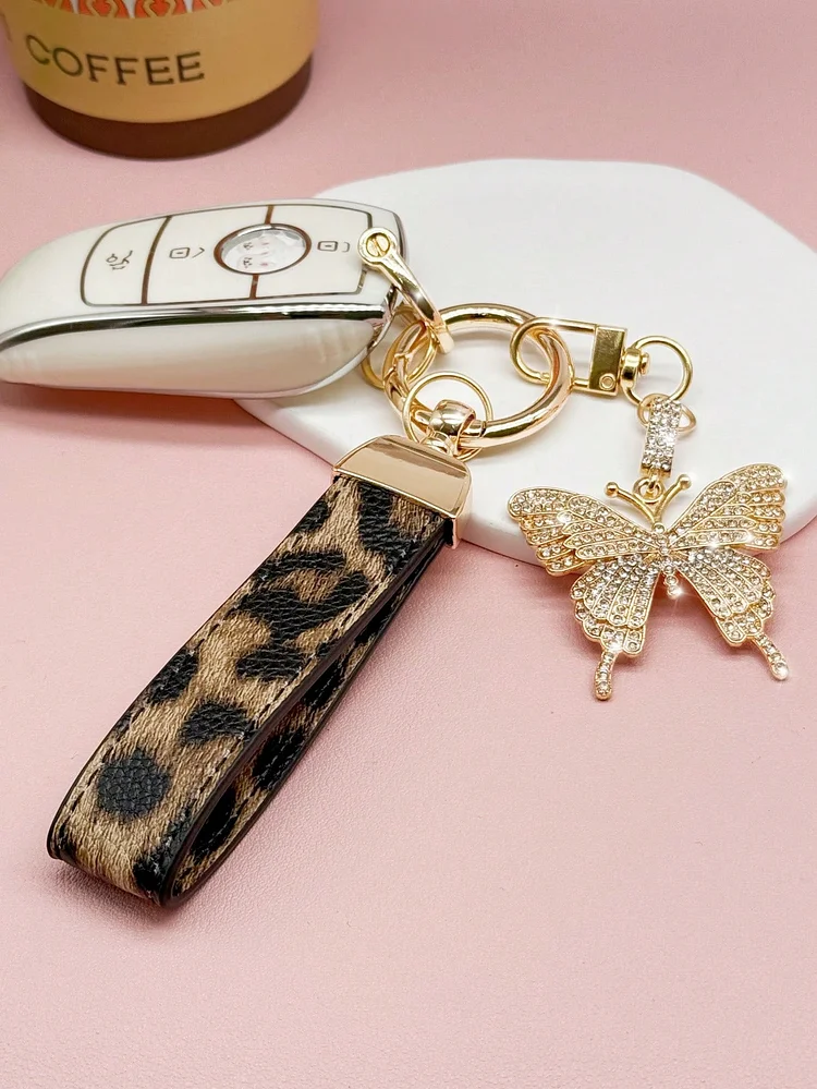 A Creative Leopard Pattern Faux Leather Car Keychain With Sparkling Rhinestone Butterfly Charm