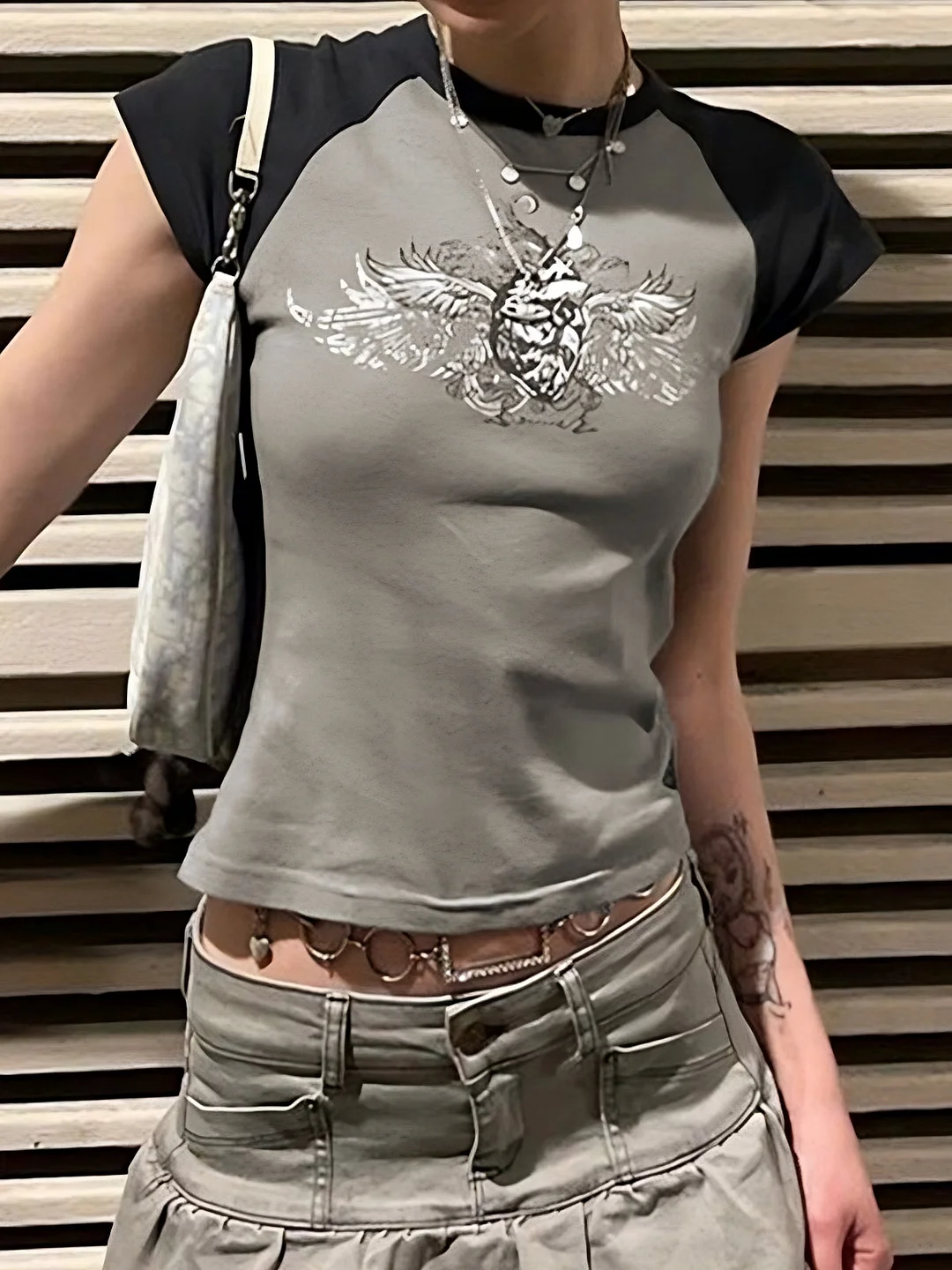 Brownm sleeve crop top with grunge batwing print