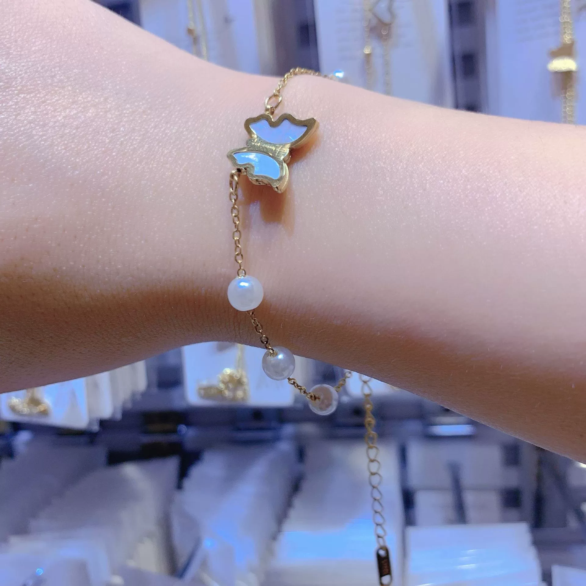Butterfly and pearl bracelet