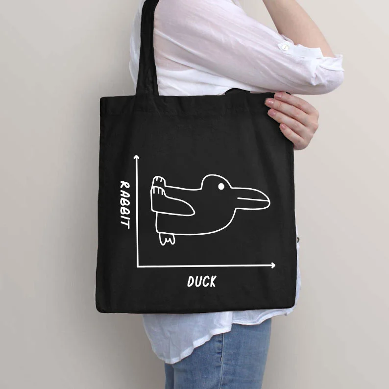 Rabbit and duck can't tell the difference between Tote Bag