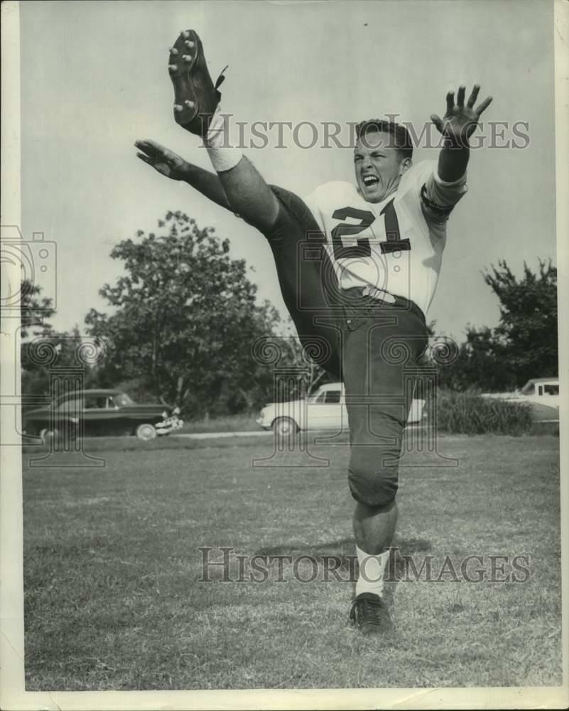 Press Photo Poster painting St. Aloysius football player George Oeshner kicks ball in practice