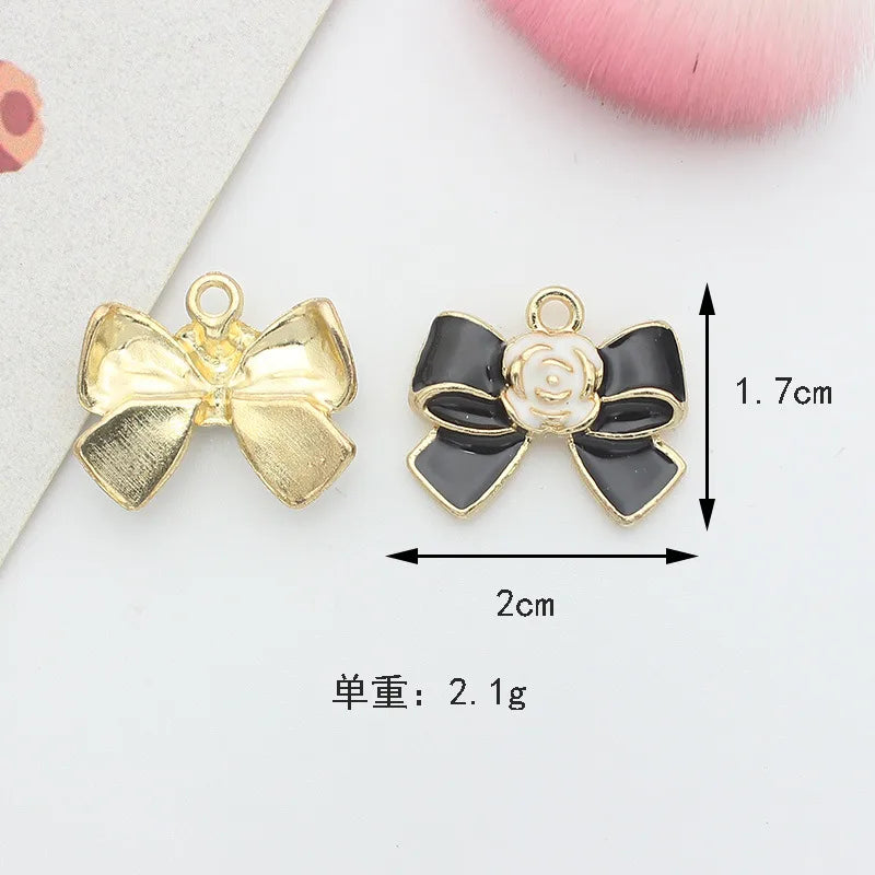 10 PCS/Package 1.5 * 20mm 14 * 14mm 7 * 12mm Alloy Rhinestones Pearl Number Heart Shape Bow Knot Polished Pendant