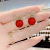 Boucles d'oreilles de no&euml;l en zircon brillant, n&oelig;ud boule rouge