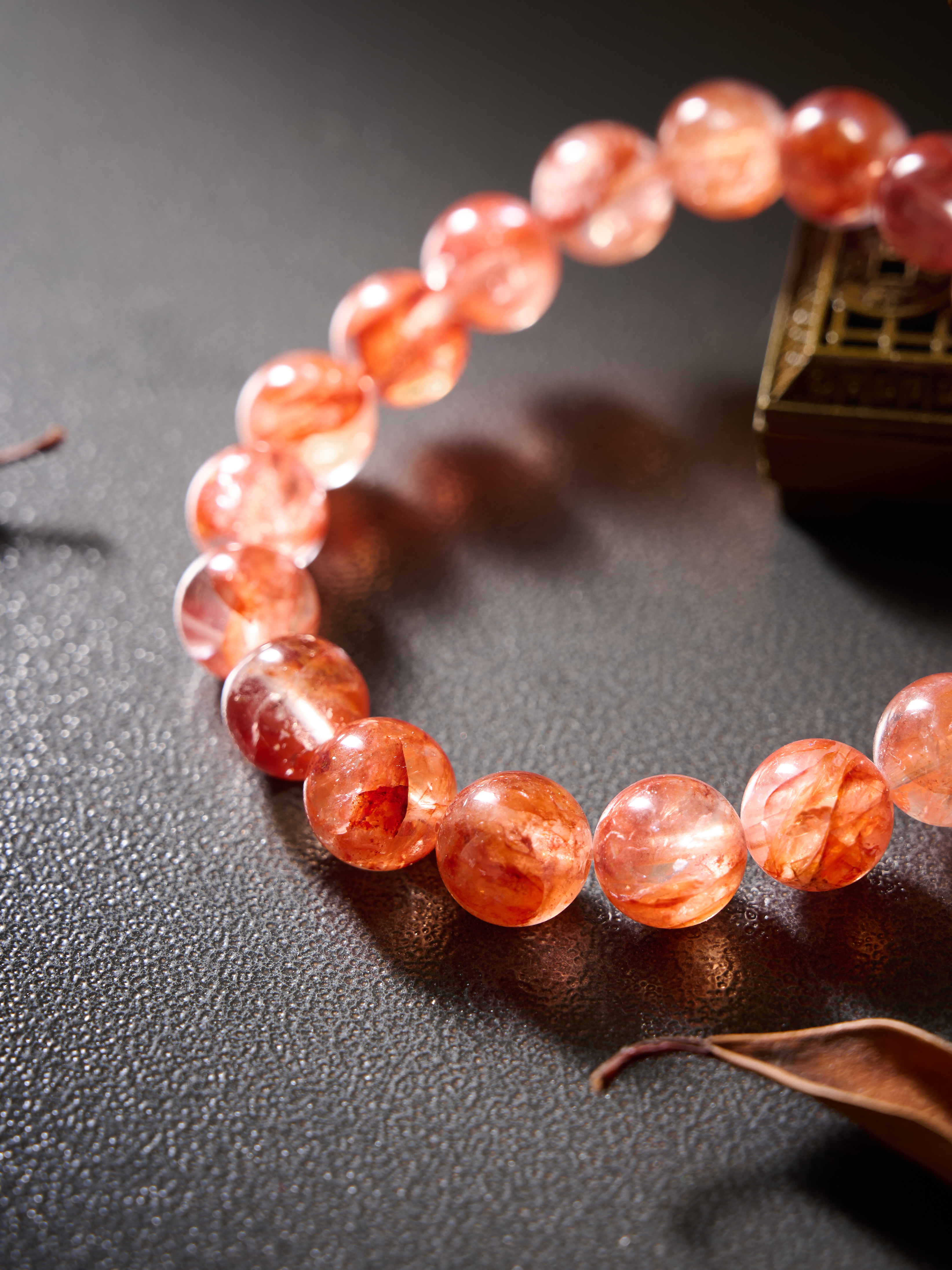Extreme detail of knot/spacer area with layered red textures inside the quartz bead