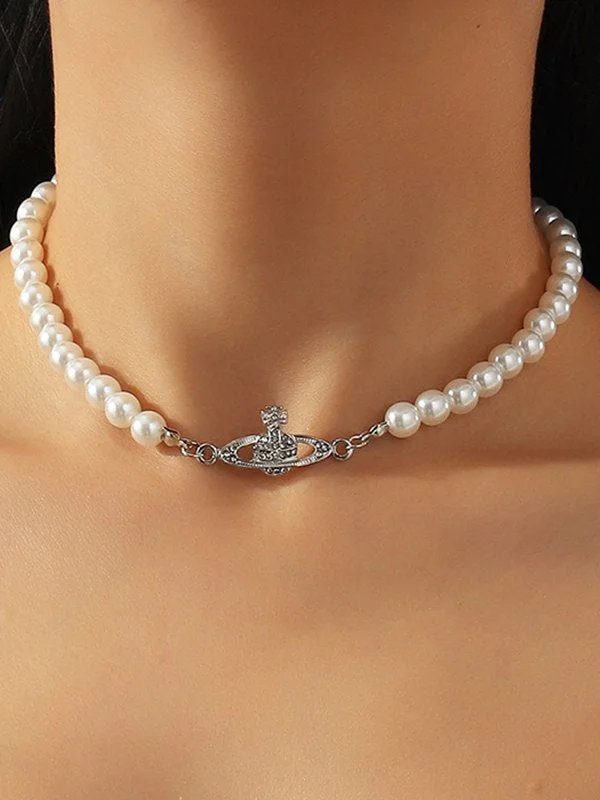 Brownm faux pearl necklace with planet detail