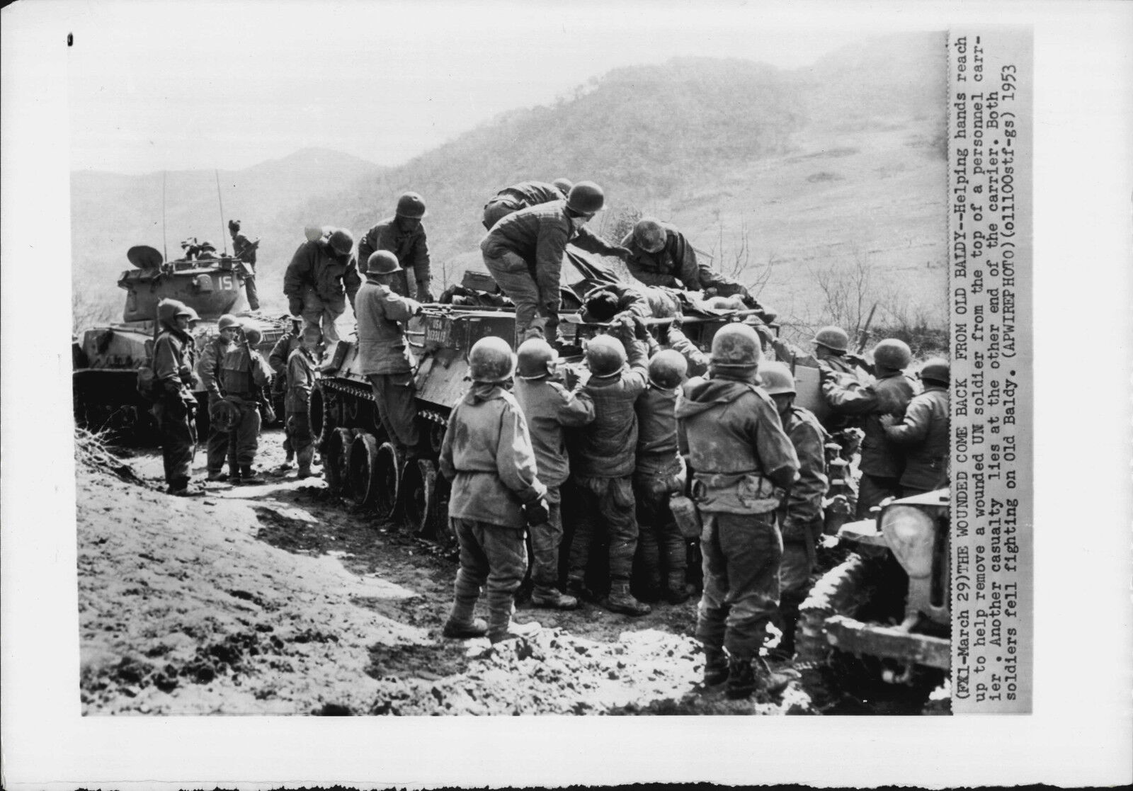 Wounded Carried Atop Armored Personal Carrier 1953 Korea War Press Photo Poster painting