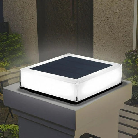 Solar-powered LED post cap light with a modern square design, featuring a translucent housing that emits a soft glow. Ideal for outdoor use on fence posts, deck railings, or garden pillars.