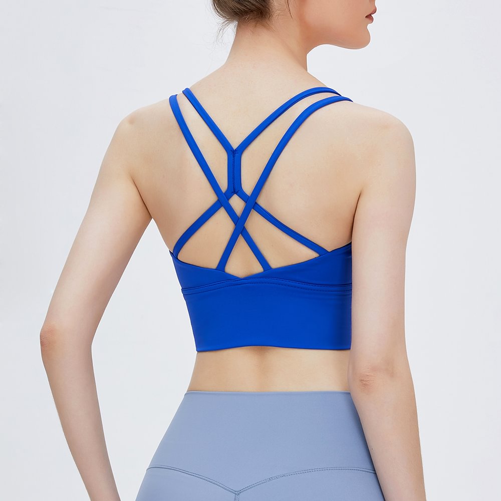 Shop klein blue criss cross back sports bra at a great price on Hergymclothing