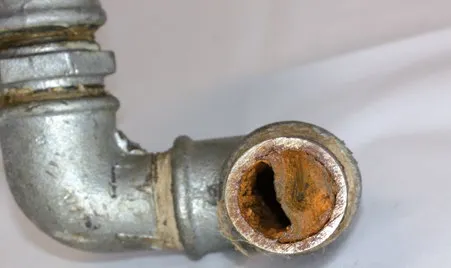 Pipe blocked with limescale and rust