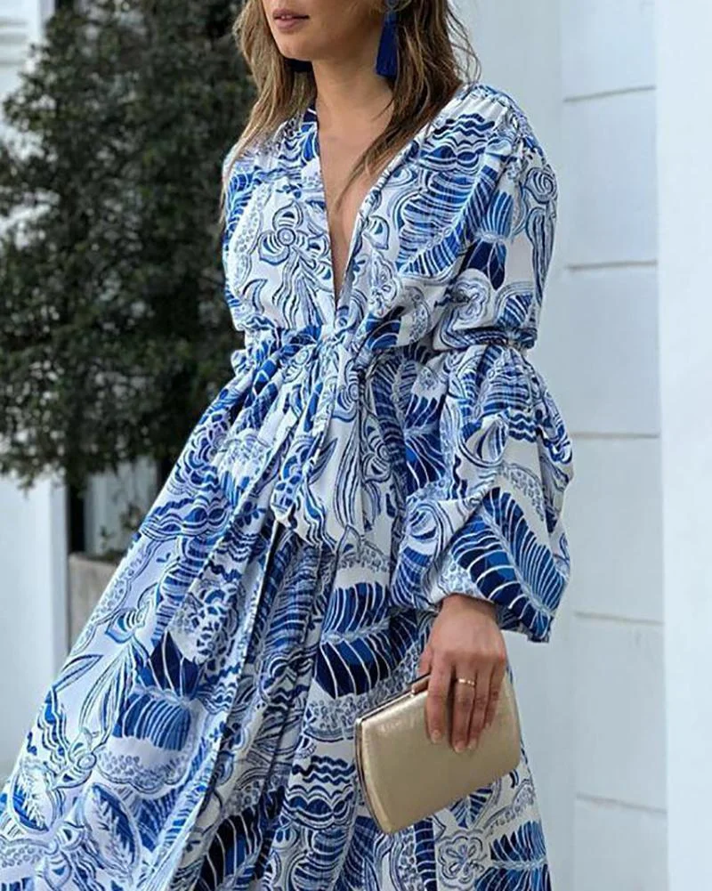 Printed dress with deep V neck and high waist with flared sleeves