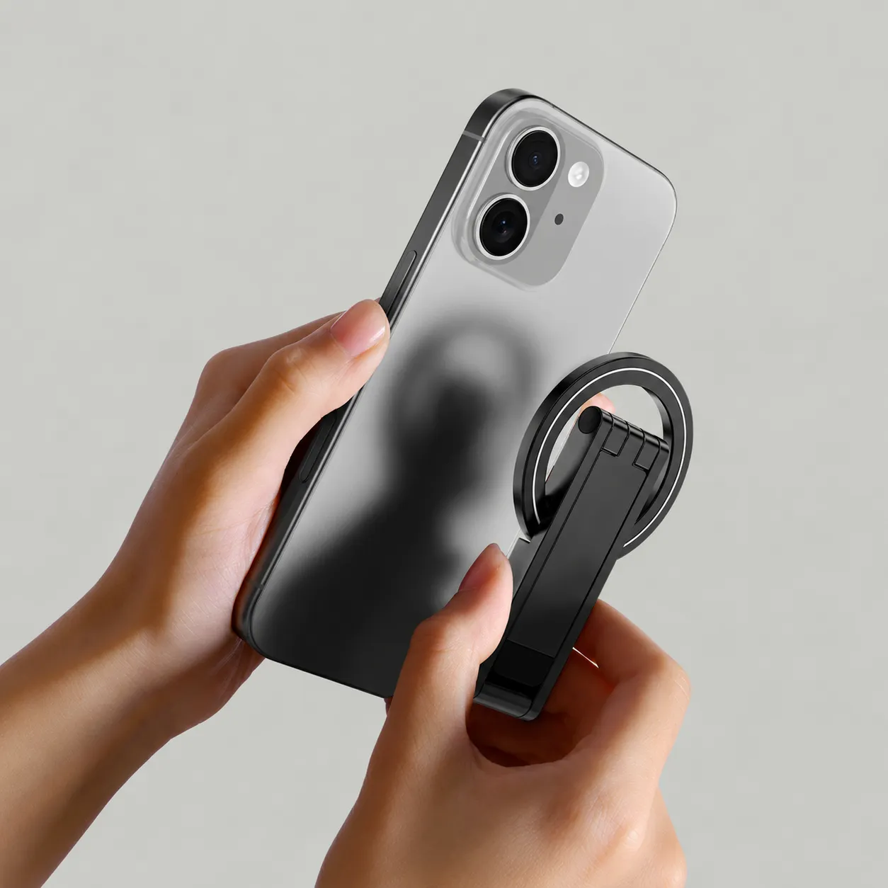 Magnetic attachment demonstration with a hollow ring and folded tripod